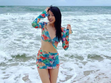Nữ công an xinh nhất nhì màn ảnh mê diện đầm ngắn khoe chân thon trắng nuột đi biển