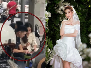 Đỗ Mỹ Linh và con trai bầu Hiển ngồi ăn lề đường, lộ thời điểm đám cưới trùng với 3 sao Việt