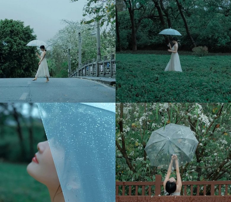 A woman holding an umbrella in the rain