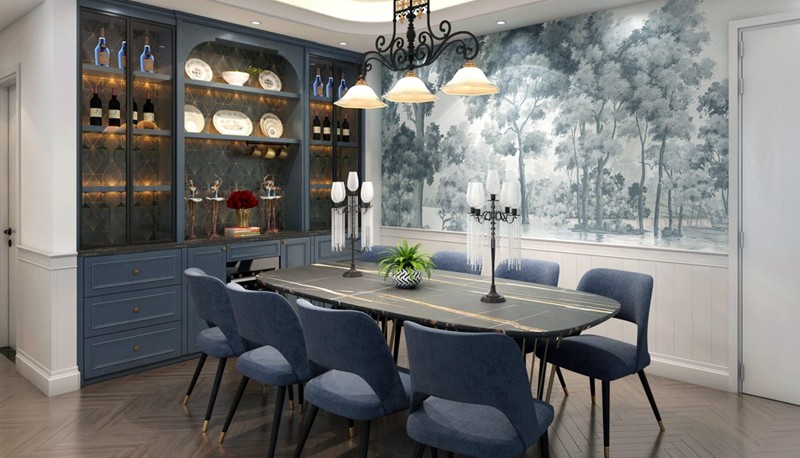 Cạnh khu vực bàn ăn là tủ trưng bày để rượu và những món đồ decor lạ mắt. Trên tường còn có bức tranh lớn gam xám xanh nhẹ nhàng.
