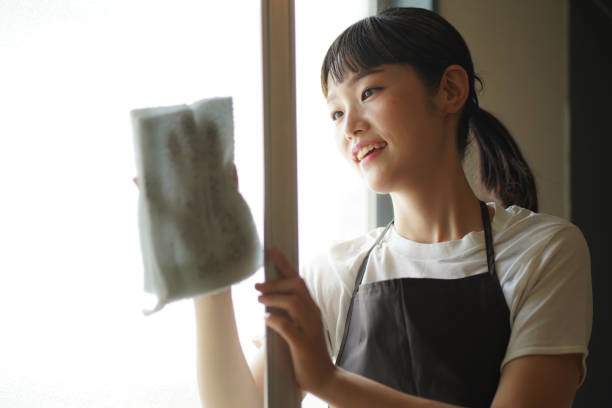 A person holding a cleaning tool