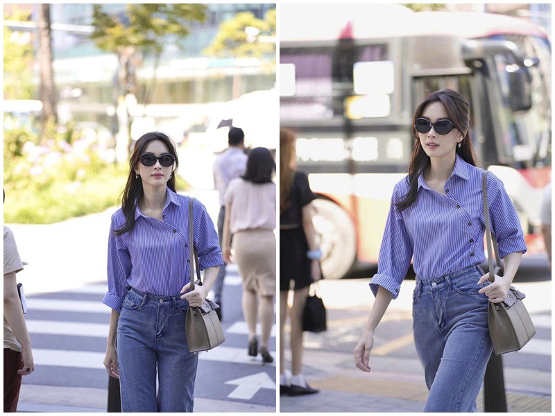 Ngoài hình ảnh bên chồng thì Đặng Thu Thảo cũng làm người hâm mộ một phen choáng ngợp khi dạo bước trên phố Seoul. Người đẹp quê Bạc Liêu chọn diện trang phục sơ mi màu xanh sọc trắng “kín cổng cao tường” và quần jeans đơn giản. 

