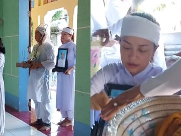 Hoa hậu Ngọc Châu mắt sưng tấy đỏ hoe vì khóc nhiều, ôm chặt di ảnh của mẹ trong lễ an táng