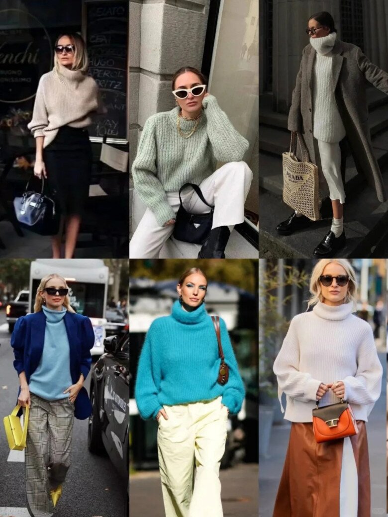 A woman wearing a white turtleneck sweater, blue jeans, and a black bag, posing on a street.