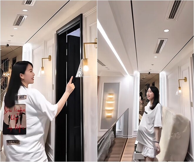Hành lang tầng 9 có một kệ sách, đã lắp đèn tường xinh xắn. Cuối hành lang có một hệ gương. Có thể thấy, vợ chồng Ngô Mai Phương chăm chút từng góc một.
