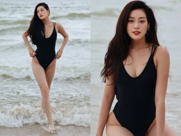 Khánh Vân khoe vòng eo 61cm với áo tắm kín trước hở sau