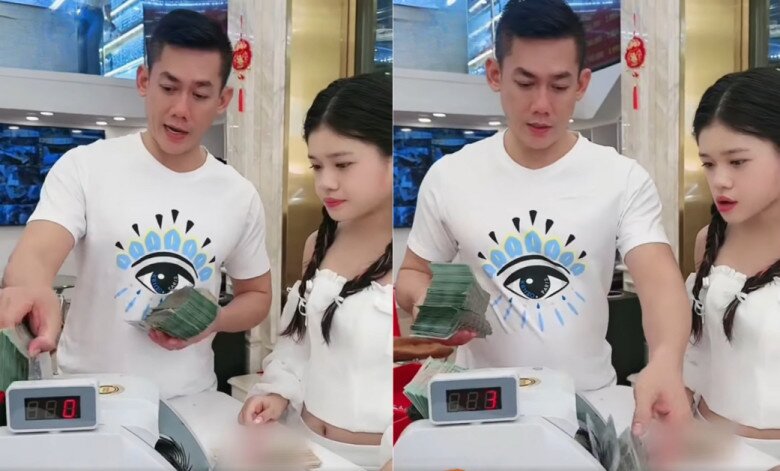 Minh Vy phải dùng máy đếm tiền để đếm tiền lì xì.