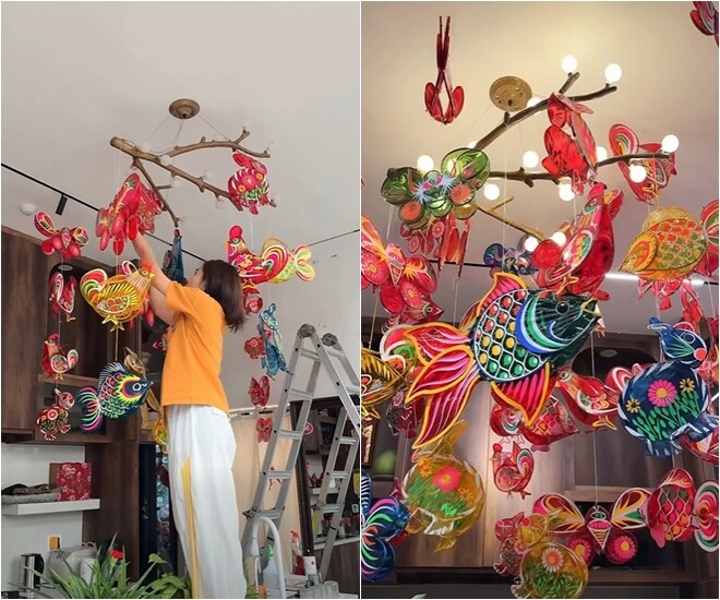 Vân Trang cẩn thận trèo lên thang để điều chỉnh vị trí từng chiếc đèn, tạo nên một bầu trời rực rỡ sắc màu ngay trong căn bếp.
