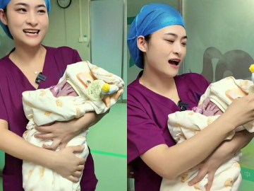 Bác sĩ vừa bế em bé sơ sinh ra ngoài phòng mổ, cả nhà chưa kịp nhìn, đứa trẻ đã liên tục lấy tay che mặt