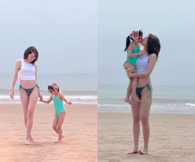 Khoảnh khắc Bảo Anh cùng con gái dạo chơi trên bãi biển.