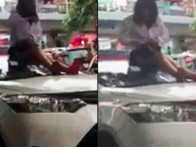 Bị bắt lỗi vượt đèn đỏ, nữ tài xế trèo lên nóc xe lăng mạ CSGT