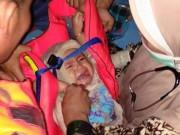 Tin tức - Sự thật về bức ảnh em bé sống sót trong thảm họa rơi máy bay ở Indonesia