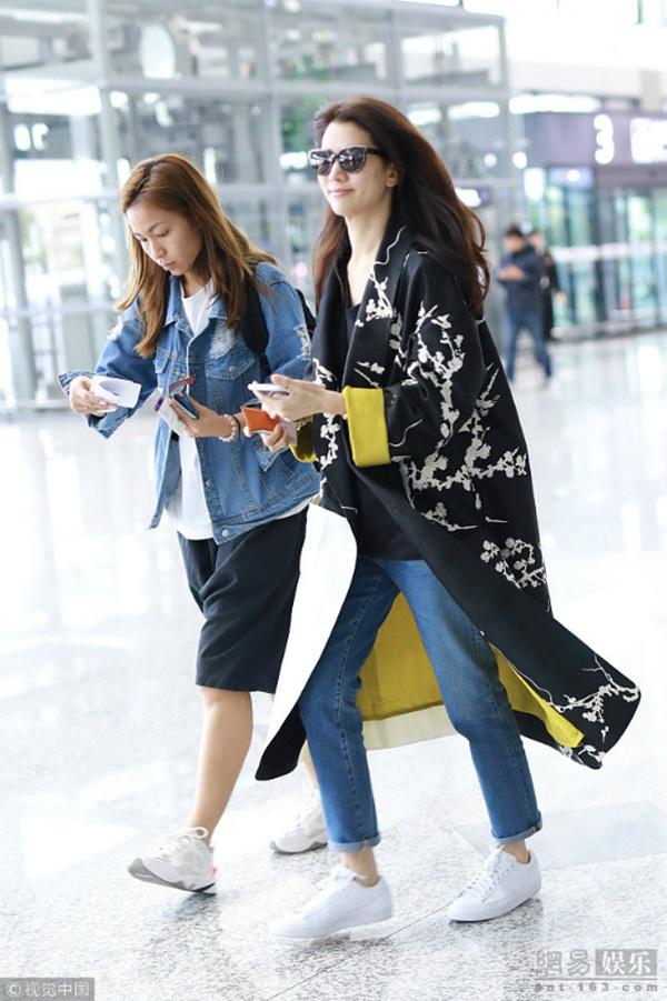 dang duoc nguong mo nhat cbiz, vo chong vien vinh nghi bat ngo to tieng cai nhau o san bay - 5