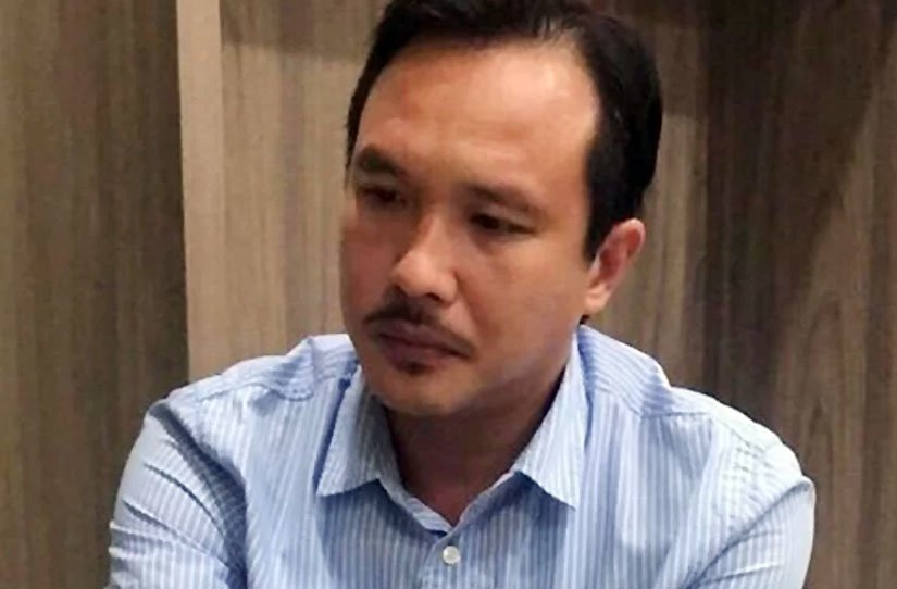 Nguyễn Hoàng Long tại cơ quan điều tra. Nguồn: VNE