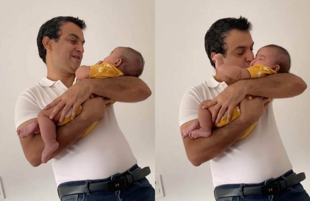 Ông xã Ấn Độ của Võ Hạ Trâm cũng được khen chăm con giỏi, bế bé gọn gàng khi ru ngủ.