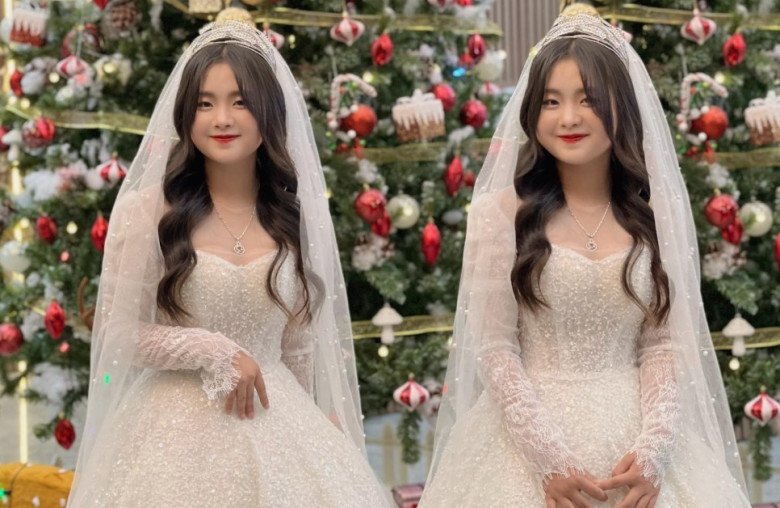 Phúng Phính bất ngờ chia sẻ hình ảnh trong bộ váy cưới màu trắng điệu đà. Cô nhóc đội thêm khăn trùm đầu cô dâu thướt tha.