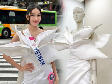 Á hậu bắn 5 thứ tiếng mặc váy khoe vai thon giữa trời lạnh buốt