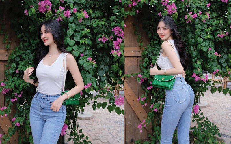 Diện combo thời trang tinh giản gồm áo thun ba lỗ trắng, quần jeans cạp cao nhưng cô nàng vẫn trông sang chảnh hết mức. Đó là nhờ vào thiết kế túi hiệu mà cô nàng đang kết thân đến từ nhà Dior.