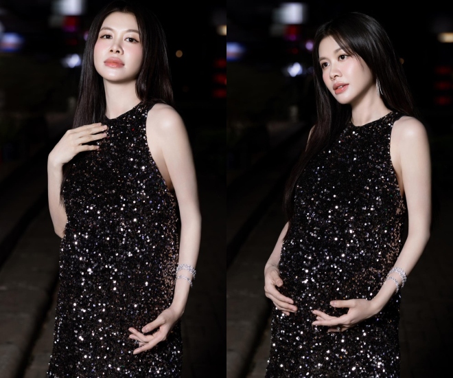 Mẹ bầu cực slay với váy đen ngắn khoe làn da trắng hồng.