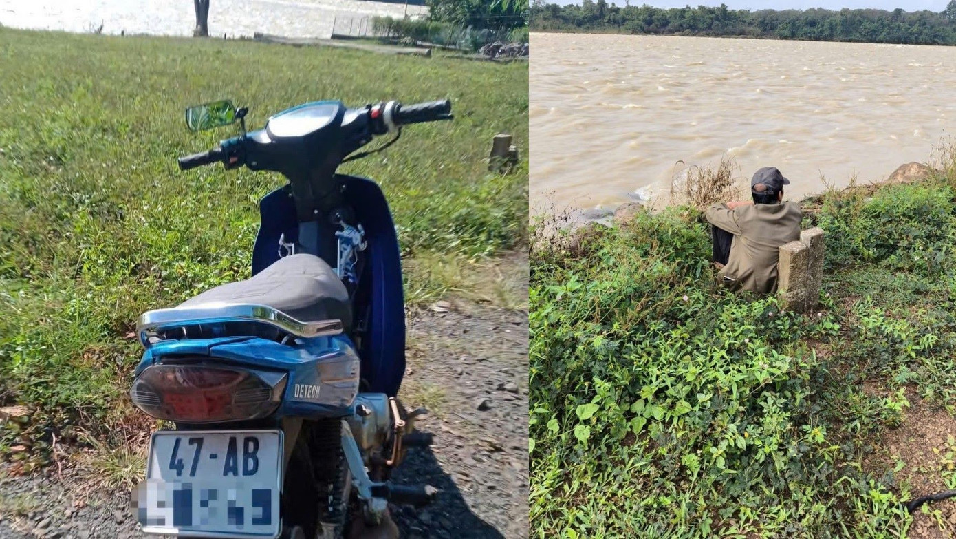 Người cha nữ sinh ngồi lặng lẽ bên bờ sông, gần nơi phát hiện xe máy và cặp sách của con.