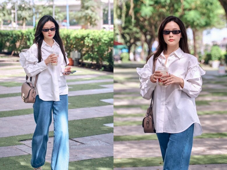 Midu xuống phố với áo sơ mi trắng oversize với chi tiết xếp bèo ở tay, tăng vẻ nữ tính cùng quần jeans đơn giản. Set đồ phóng khoáng, thoải mái này là lý do khiến tin đồn cô mang bầu lại được bàn tán.