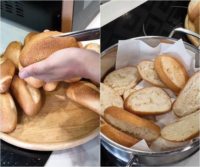 Huỳnh Anh cẩn thận cắt đôi từng ổ bánh, tạo mặt phẳng để dễ phết bơ tỏi. Các lát bánh được xếp gọn gàng để chuẩn bị đem đi nướng lại.