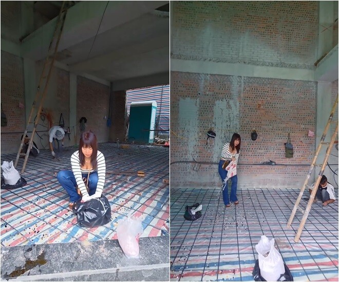 Khoảnh khắc vợ anh đang rải đá thạch anh trên sàn nhà đang thi công, phần sàn vẫn lộ thép và vải bạt bảo vệ cho thấy bước thi công nền phía dưới chưa hoàn thiện lát cuối cùng.