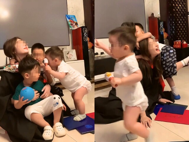 3 đứa trẻ chạy vào khung hình ôm chầm lấy mẹ.