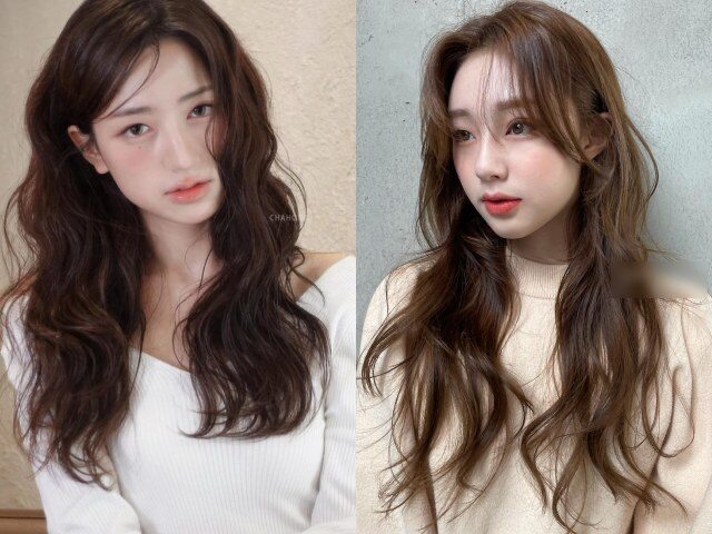 Tóc xoăn nhuộm nâu giúp gương mặt sáng hơn, trông trẻ trung và dễ phối phong cách. Gam màu này ít lộ chân tóc, phù hợp môi trường công sở.